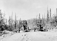 Graders level roadbed during construction