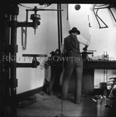 Wilbur Wright working in bicycle shop