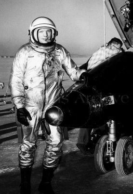 NASA test pilot Neil Armstrong next to X-15 after flight