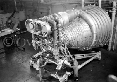 Technicians inspect F-1 engine for the Saturn V rocket