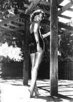 Rhonda Fleming wearing swimsuit