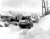 1st Division Troops on Tank During Advance in Schopen, Belgium