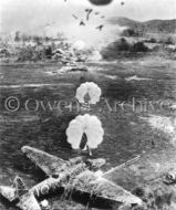 Parachute bombs over Japanese airfield