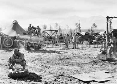 388th Battalion repairing trucks at camp