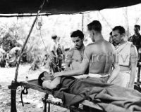 Combat medics help wounded soldier