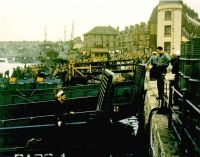 Troops on landing craft at port