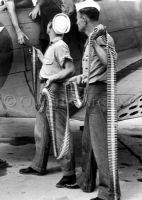 Sailors Loading Ammo Belt in Douglas SBD Dauntless