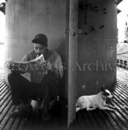 Submariner reading next to sub mascot 