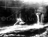 Transfer wounded men off USS Bunker Hill 