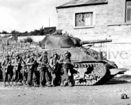 101st Airborne Take Cover Next to Sherman tank 