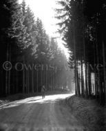 Soldier with 101st Walking in Forest After Battle 