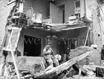 British Soldier Rescuing Puppy in Bombed Building