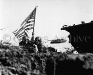 Officers with 3rd Marine Division plant the first flag on Guam