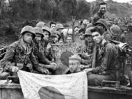 1st Marine Division hold captured flags 