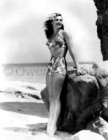 Esther Williams wearing swimsuit at beach