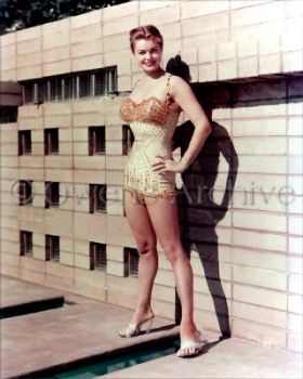 Esther Williams wearing swimsuit and high heels