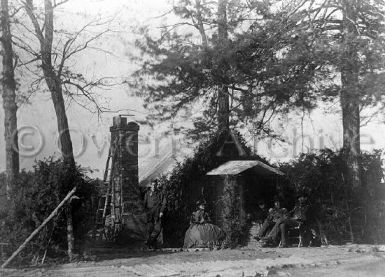 Woman and four soldiers outside tent