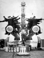 Sailors sitting on big guns U.S.S. Texas