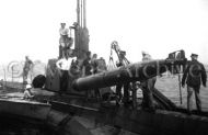 Loading a torpedo into sub, 1918