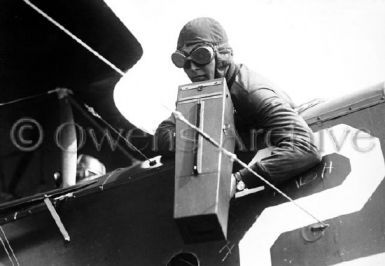 Co-Pilot Operating Aeroplane Graflex Camera