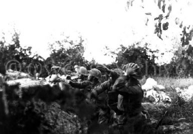 American soldiers throw hand grenades